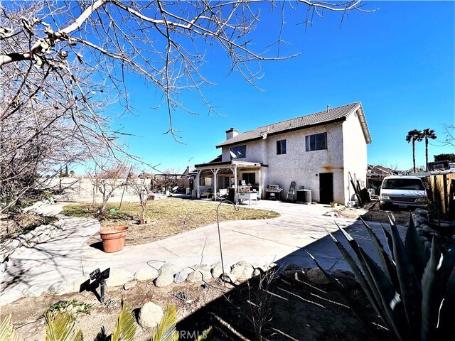 back of property featuring a patio