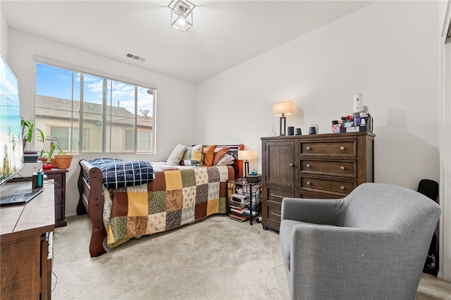 bedroom featuring light colored carpet