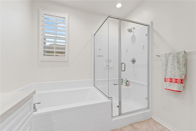 bathroom featuring recessed lighting, a shower stall, a bath, and tile patterned floors