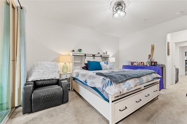 bedroom featuring light carpet