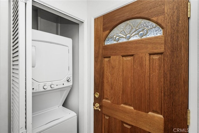 laundry area with stacked washer / drying machine