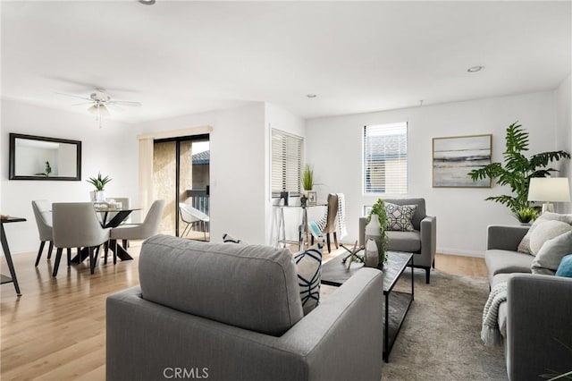 living area with ceiling fan, light wood-type flooring, and recessed lighting