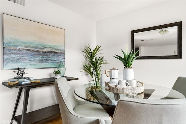 dining area with hardwood / wood-style floors