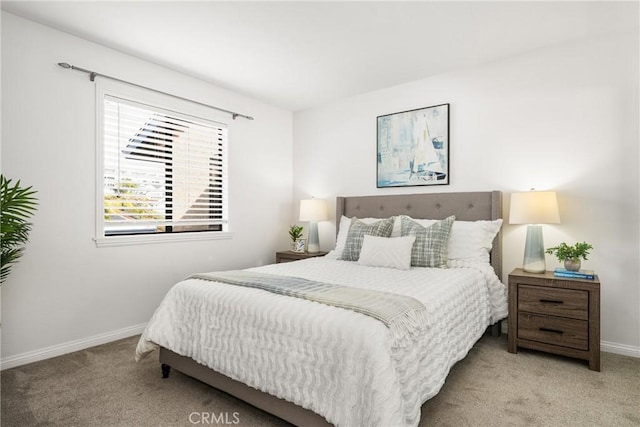 carpeted bedroom with baseboards