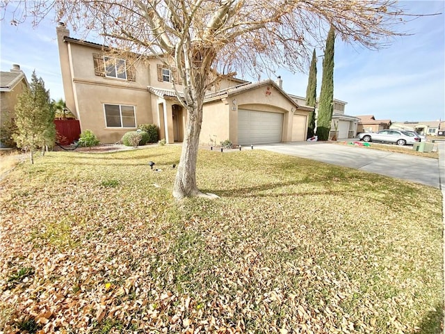 view of front of house featuring a garage and a front yard