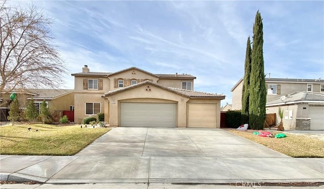 view of front of property with a garage and a front yard