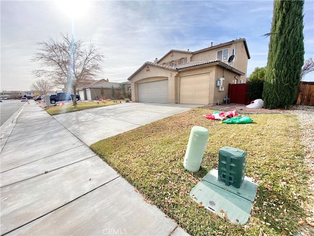 exterior space with a garage and a front lawn