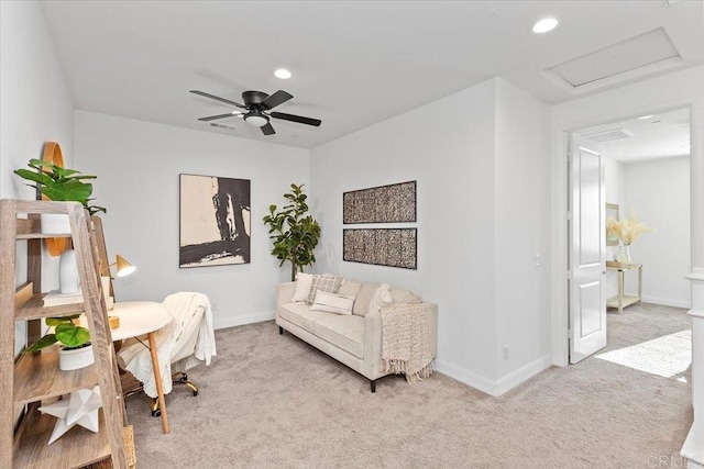 sitting room with light carpet and ceiling fan