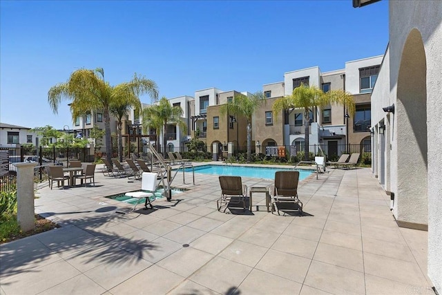 view of swimming pool with a patio area