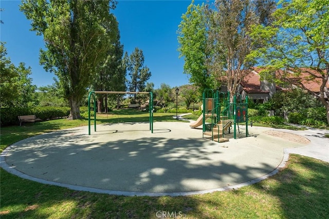 view of community featuring a lawn and a playground