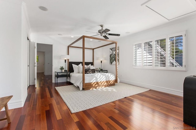 bedroom with ceiling fan and dark hardwood / wood-style flooring