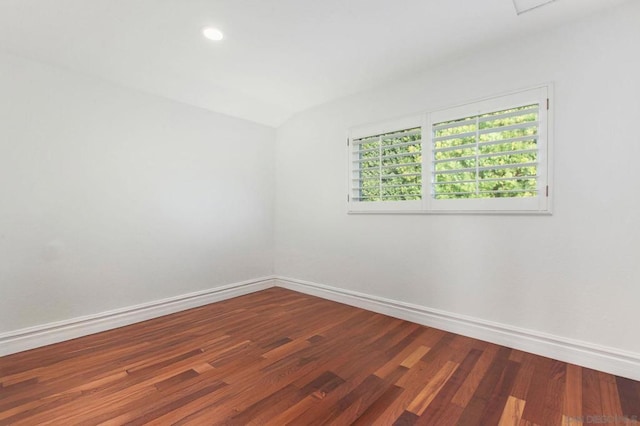 unfurnished room with hardwood / wood-style floors