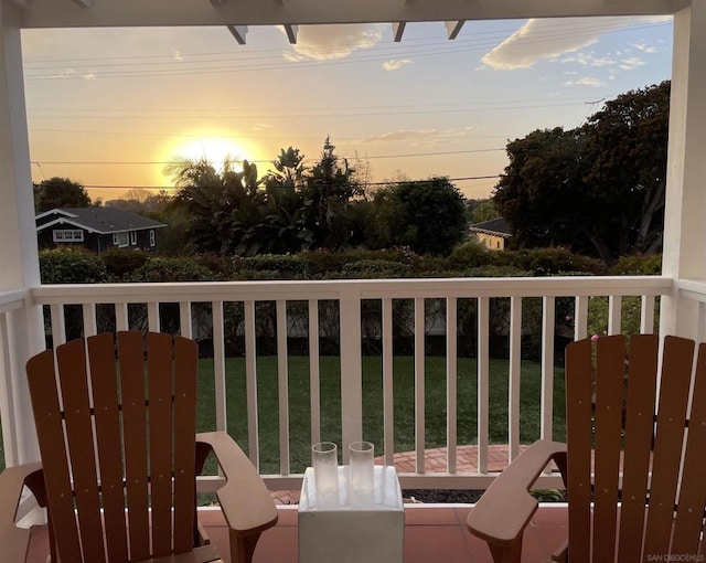 view of balcony at dusk