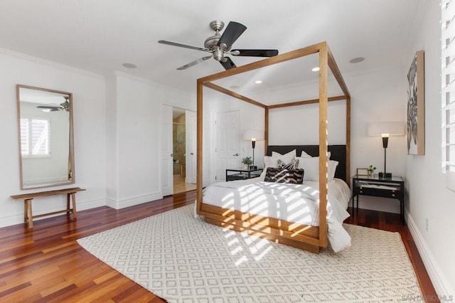 bedroom featuring ceiling fan, ornamental molding, and hardwood / wood-style floors