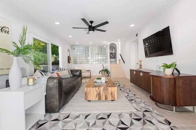 living room featuring ceiling fan and light tile patterned floors