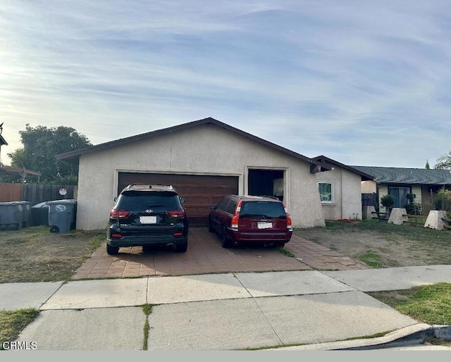 ranch-style home featuring a garage