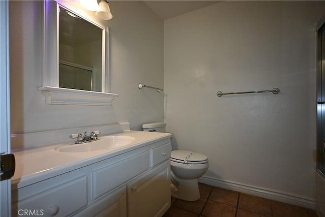 bathroom featuring tile patterned floors, walk in shower, toilet, and vanity