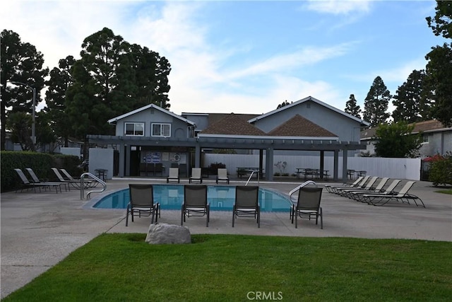 view of pool with a pergola, a lawn, and a patio