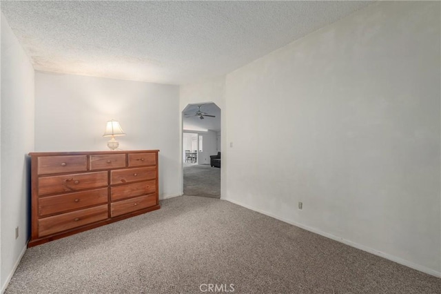 bedroom with a textured ceiling and carpet floors