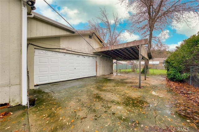 view of property exterior with a garage