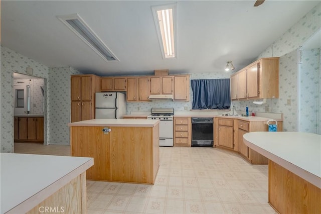 kitchen with refrigerator, white gas range oven, a kitchen island, sink, and black dishwasher