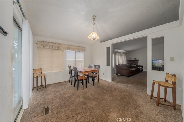 view of carpeted dining space