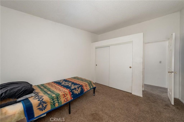 carpeted bedroom featuring a closet