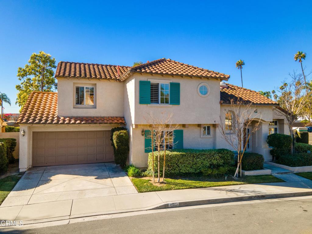 mediterranean / spanish house with a garage