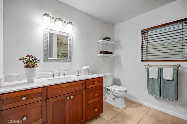 bathroom with tile patterned floors, vanity, and toilet