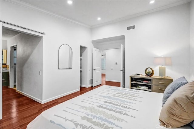 bedroom featuring dark wood-type flooring and crown molding