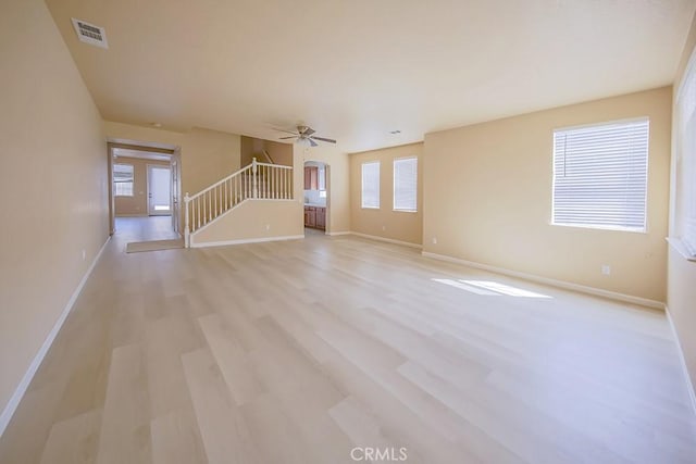 unfurnished living room with light wood-type flooring