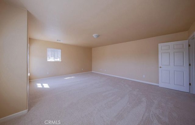 unfurnished room featuring carpet