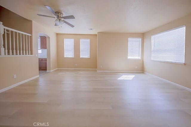 unfurnished room featuring ceiling fan and light hardwood / wood-style floors