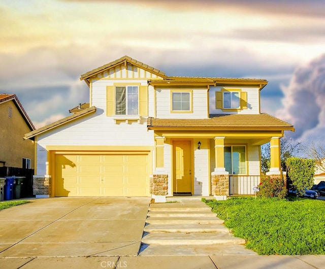 craftsman-style home featuring covered porch and a garage