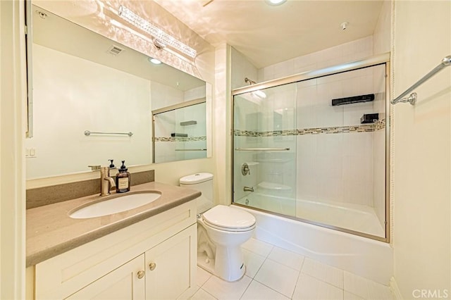 100 S Alameda St Unit 307, Los Angeles, CA 90012 - full bath with tile patterned flooring, toilet, vanity, and shower / bath combination with glass door