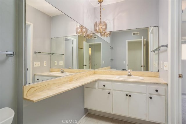 bathroom featuring vanity and an inviting chandelier