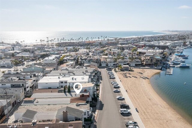 aerial view with a view of the beach and a water view