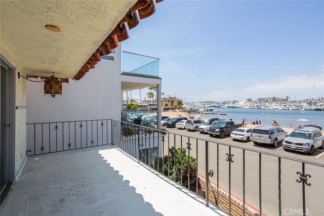 balcony featuring a water view