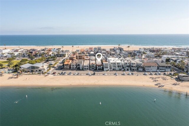 birds eye view of property featuring a water view and a view of the beach