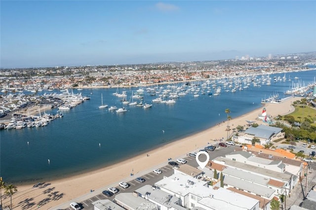 bird's eye view with a view of the beach and a water view