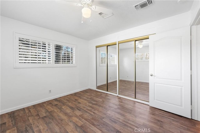 40836 36th St W, Palmdale, CA 93551 - unfurnished bedroom featuring two closets, wood finished floors, baseboards, and ceiling fan