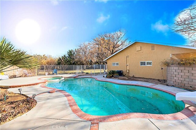 40836 36th St W, Palmdale, CA 93551 - view of pool featuring a water slide, fence, a patio, and a pool with connected hot tub