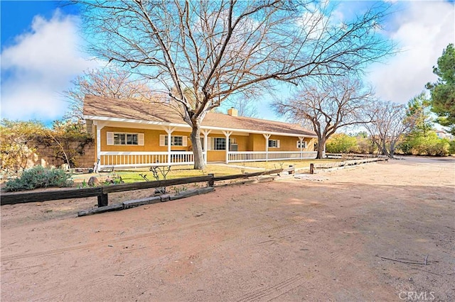 40836 36th St W, Palmdale, CA 93551 - single story home with covered porch, a chimney, and fence
