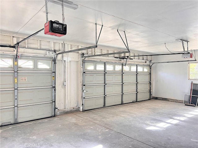 garage featuring a garage door opener