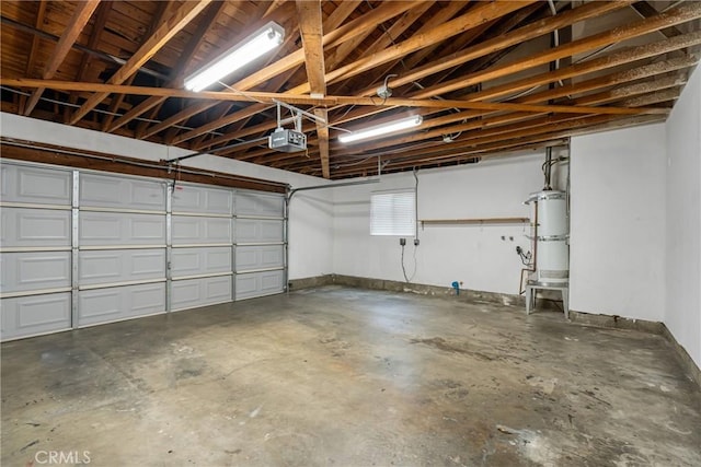 garage featuring water heater and a garage door opener