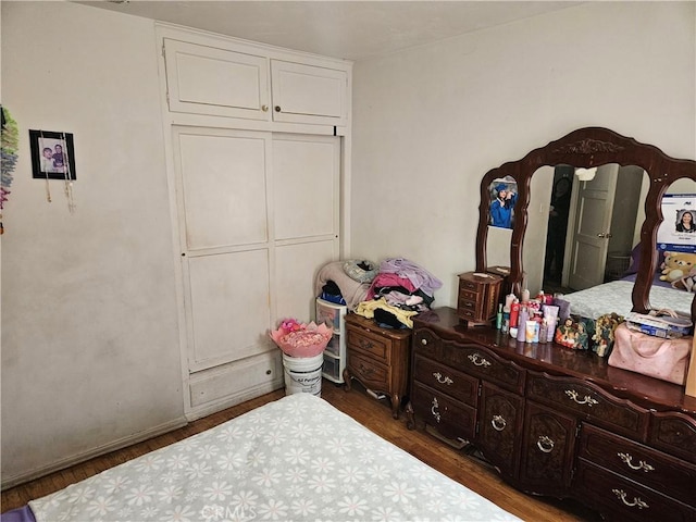 bedroom featuring dark hardwood / wood-style floors