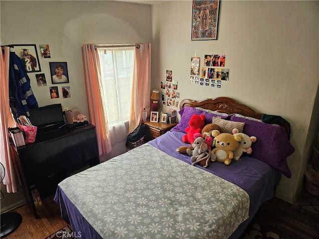 bedroom featuring dark hardwood / wood-style flooring