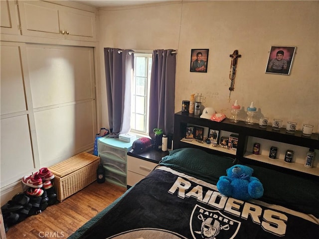 bedroom featuring hardwood / wood-style flooring