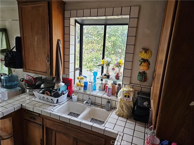 kitchen featuring sink and tile countertops