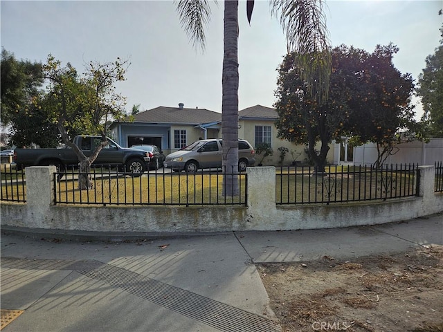 view of front facade featuring a garage and a front lawn